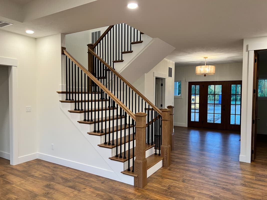 Entry hall with a dark-stained stairway