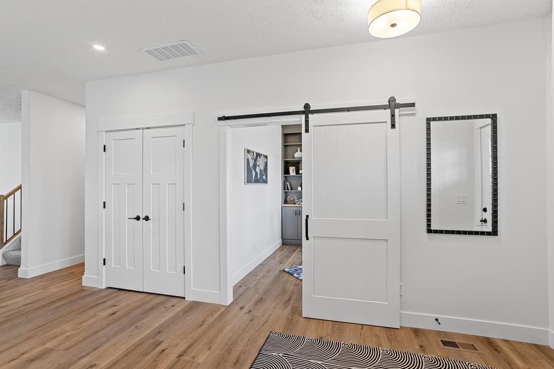 Interior barn door and paneled closet doors